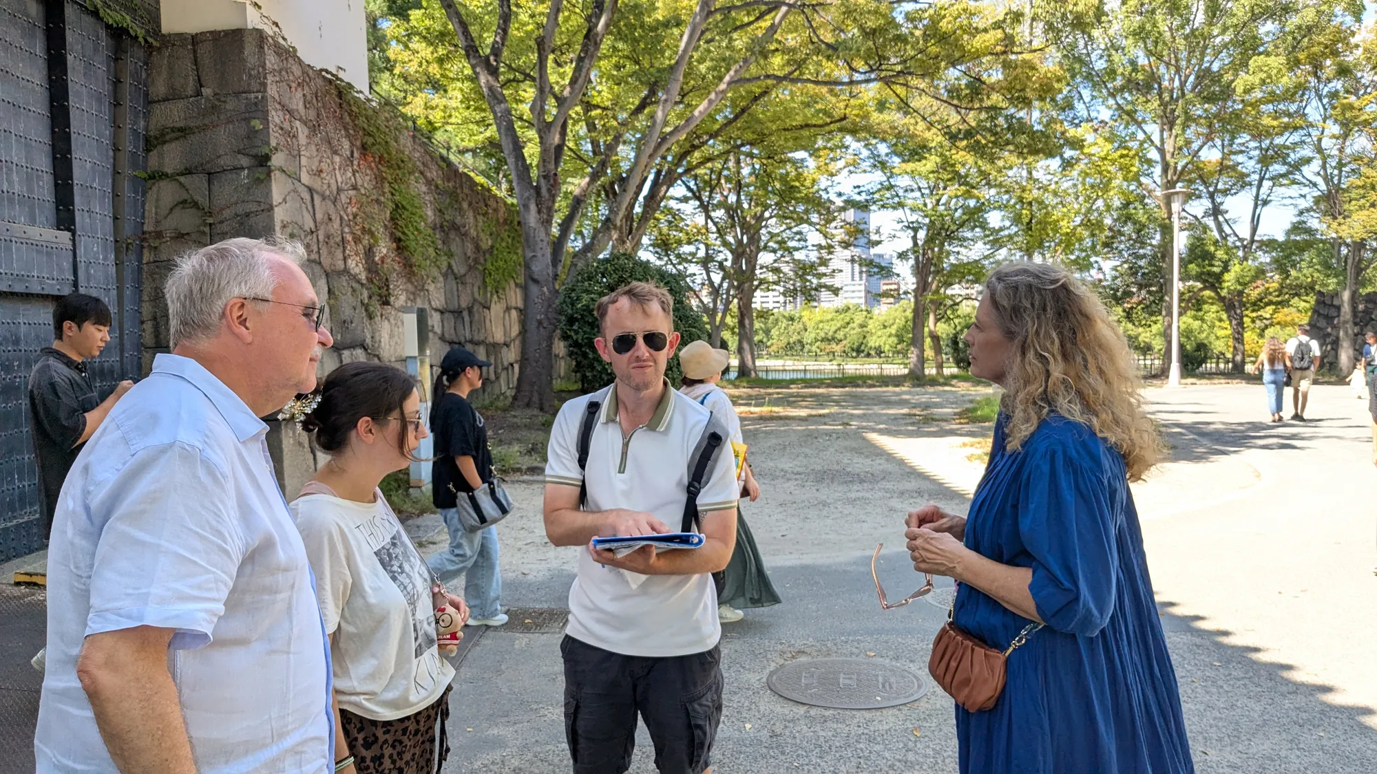 Guiding guests beside the castle gate